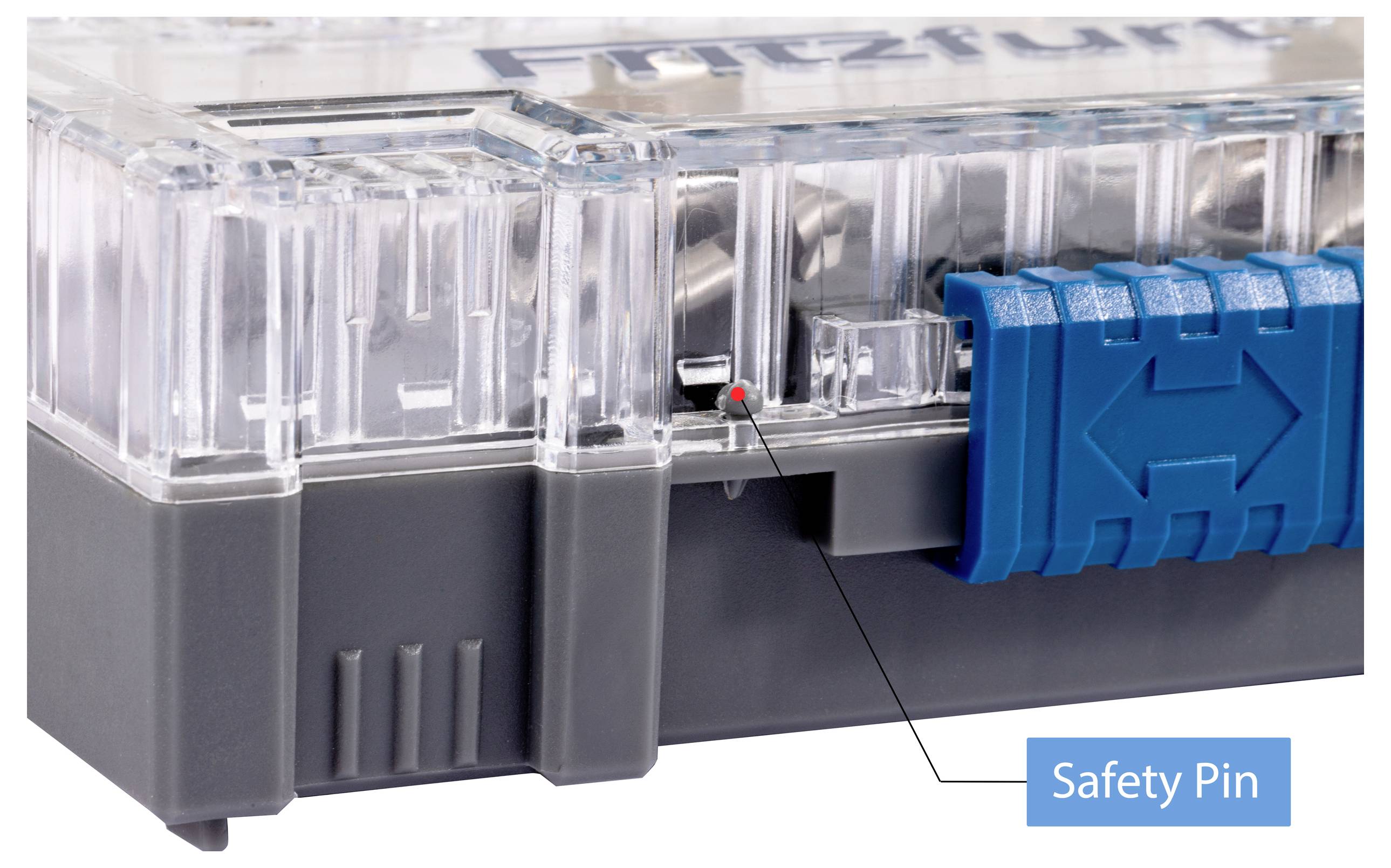 A close-up view of a transparent electrical device with a blue, adjustable handle and a marked safety pin, used for securing the device.