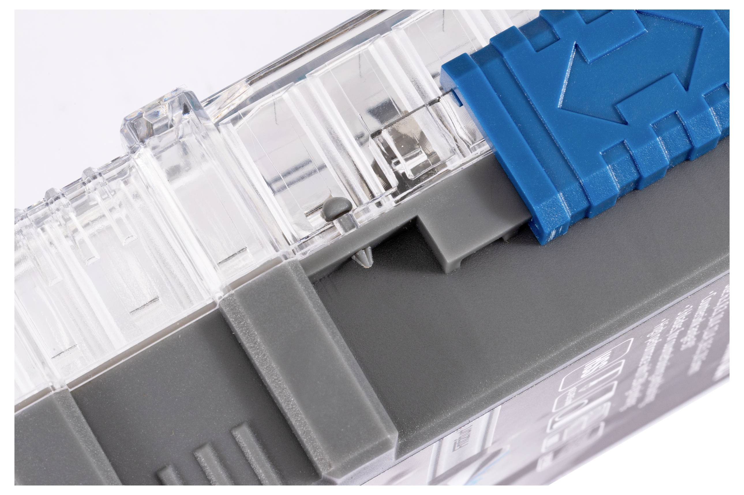 A close-up image of a transparent and blue plastic latch mechanism on a gray device, focusing on the detailed texture and structure.