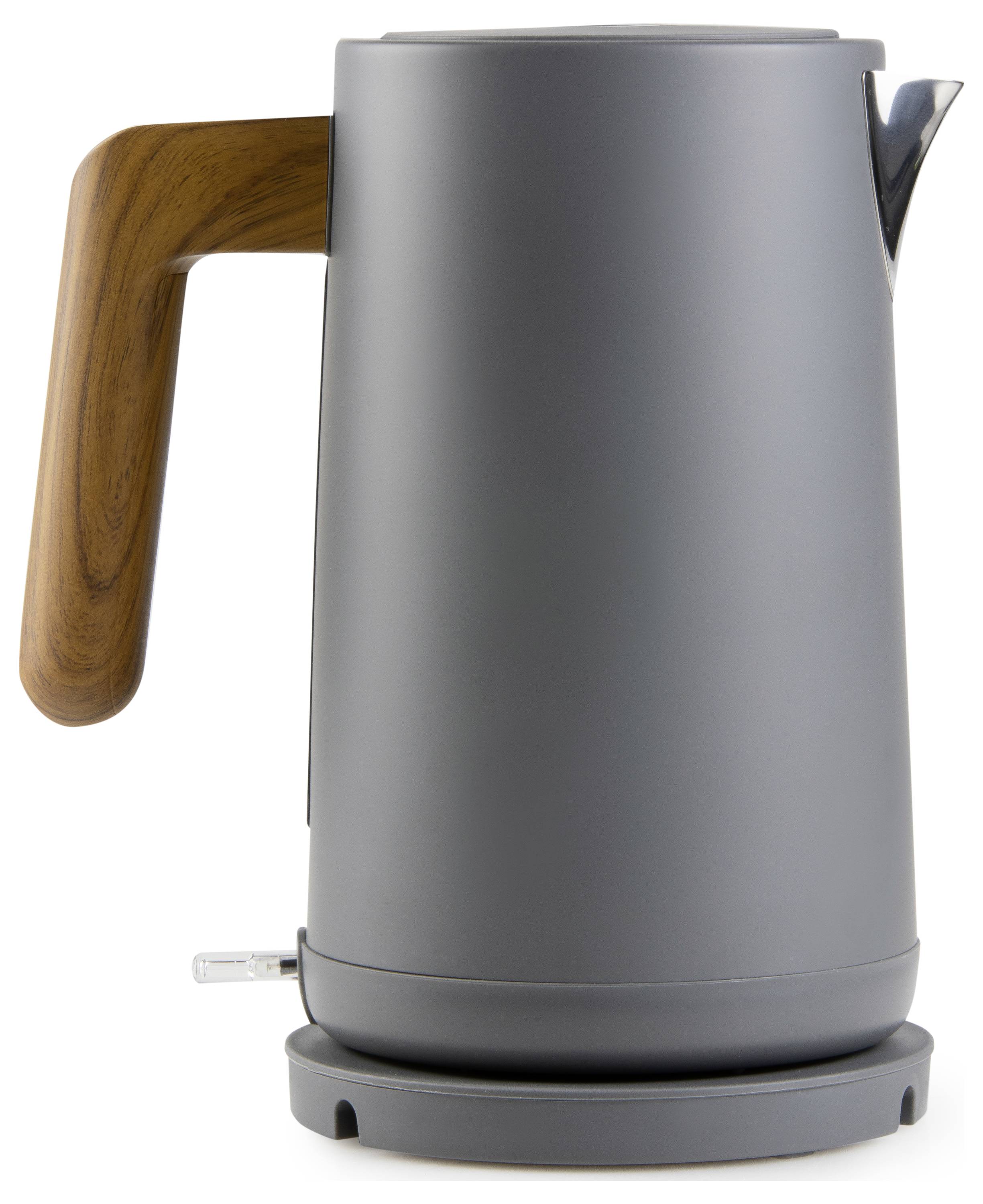 A modern, electric kettle with a grey surface and a wooden handle sits on its base.
