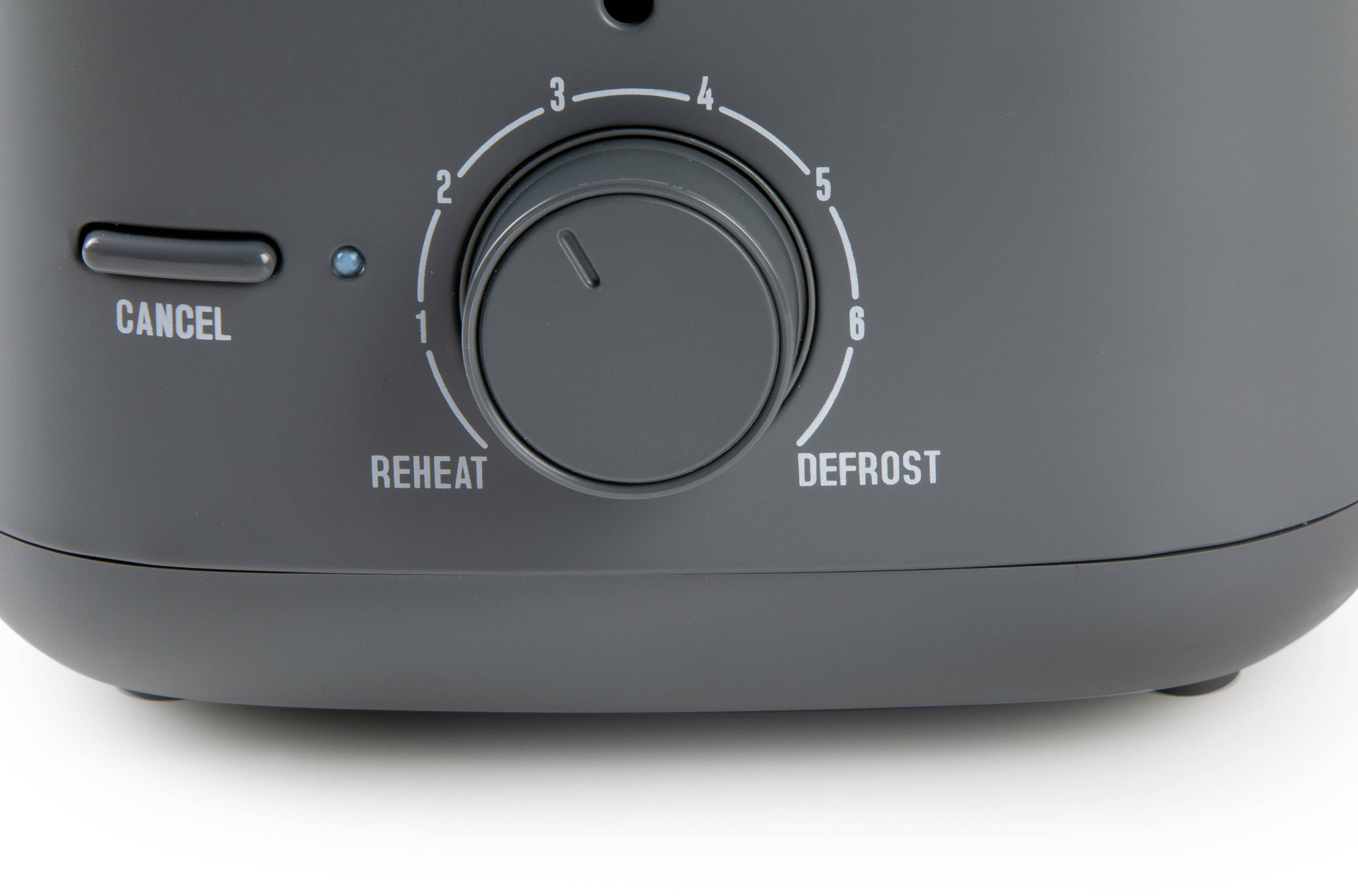 Black toaster with a rotary dial for temperature settings from 1 to 6, 'Cancel' button, with 'Reheat' and 'Defrost' functions.