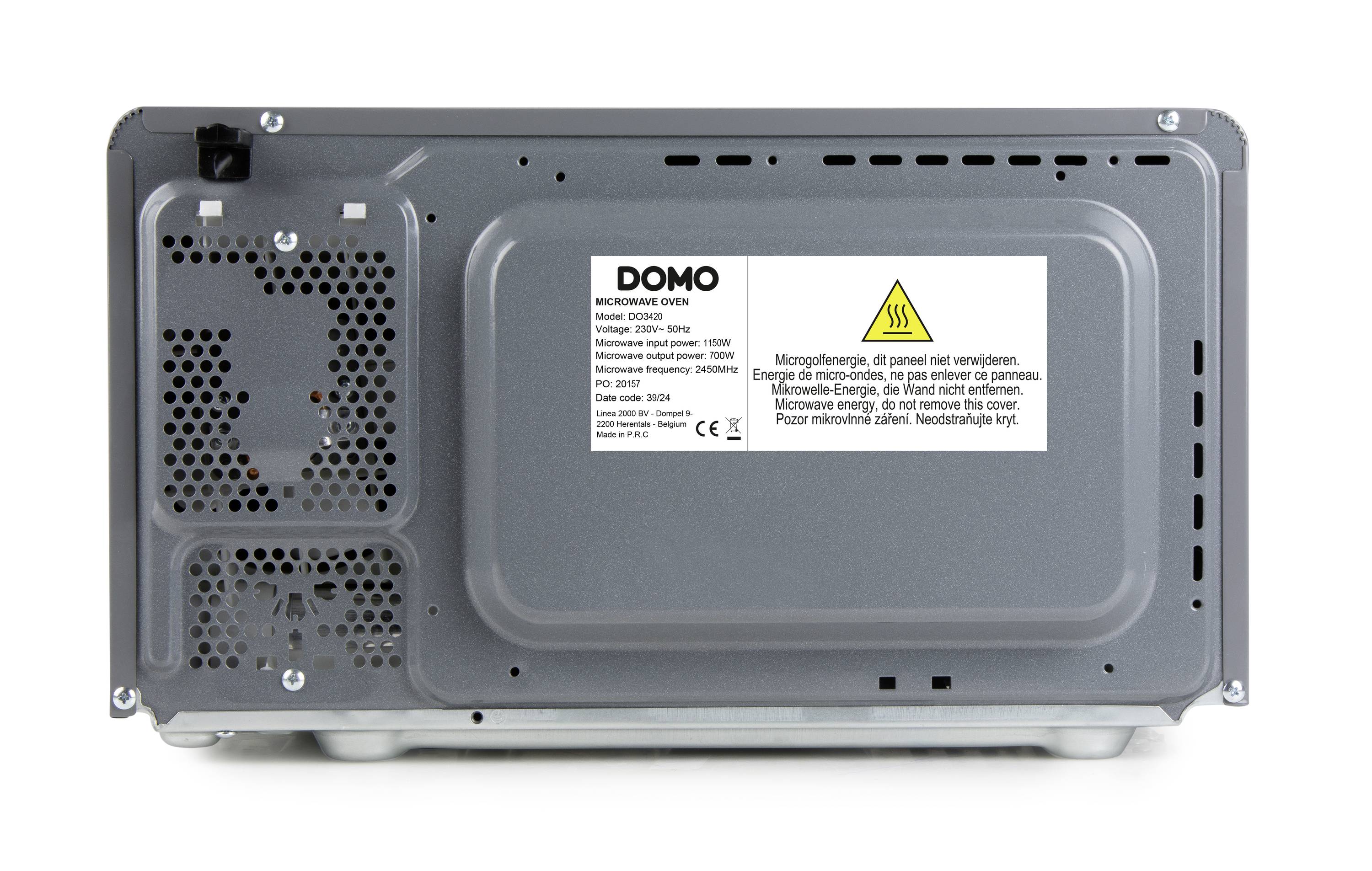 Back of a grey microwave with ventilation slots and a safety sticker with warning notices.