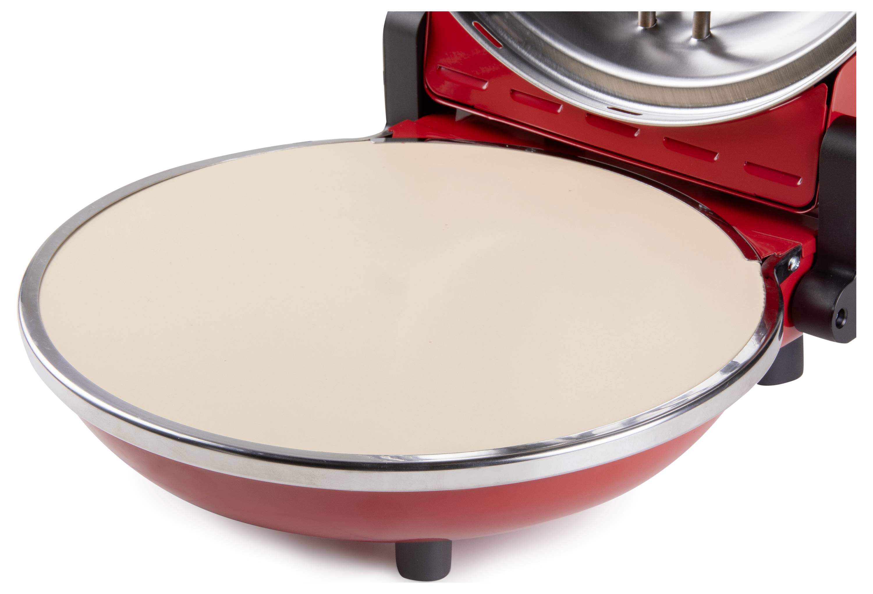 A round, red food processor with a smooth surface, open. Likely used for preparing dishes such as pizza or pancakes.