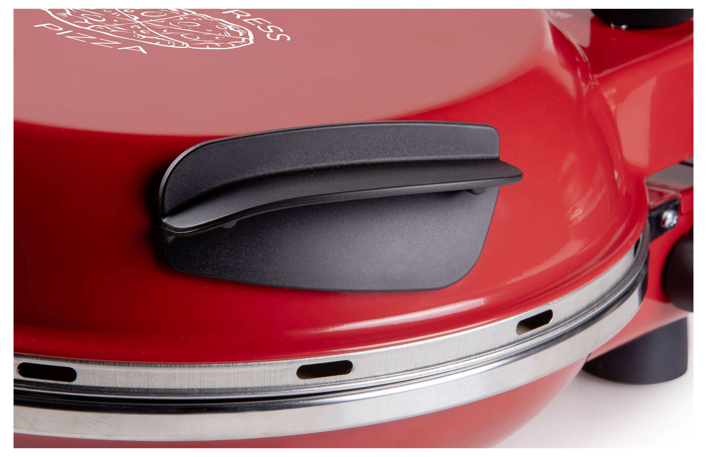 Red pizza maker with black handle on the lid, suitable for baking pizza.