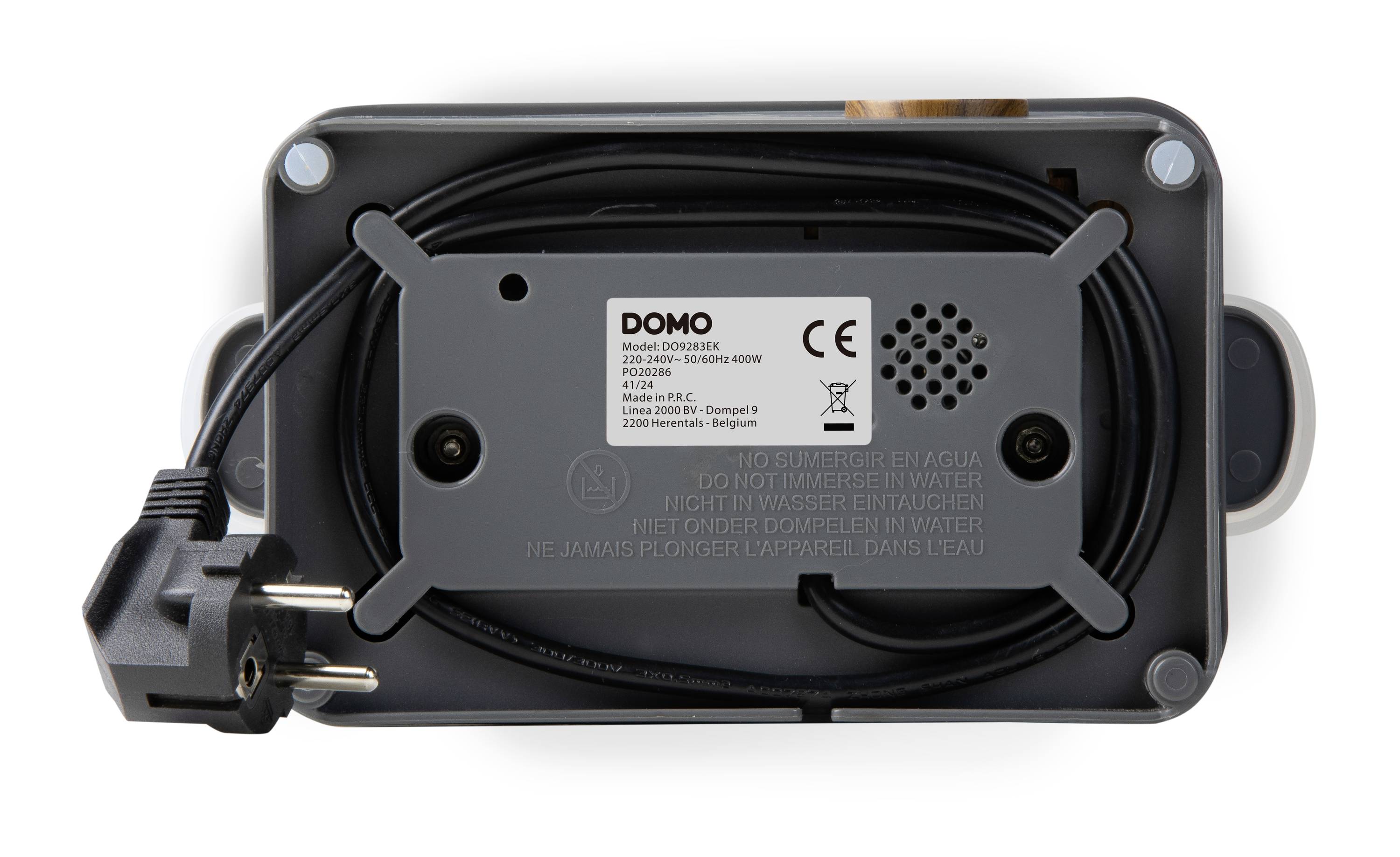 The rear side of a kitchen appliance with a power cable. The cover displays brand information and warning notices in multiple languages.