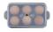 Six eggs in a transparent plastic box, viewed from above.