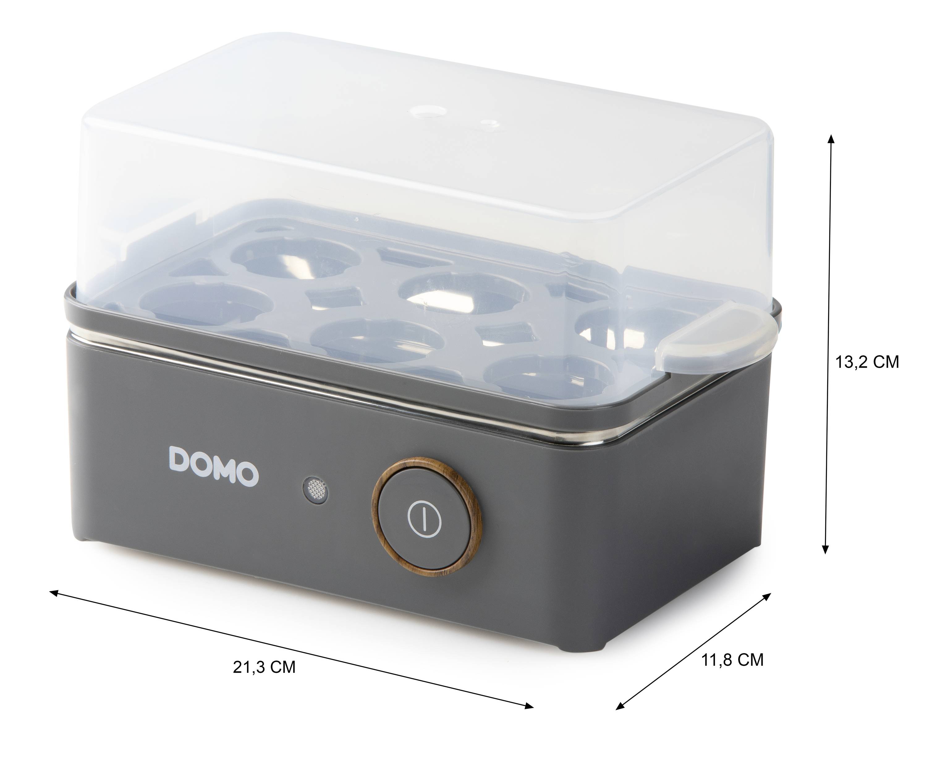 Ei-Cooker in grey with transparent lid. Dimensions: 21.3 cm width, 11.8 cm depth, 13.2 cm height. 'DOMO' marking on the front.