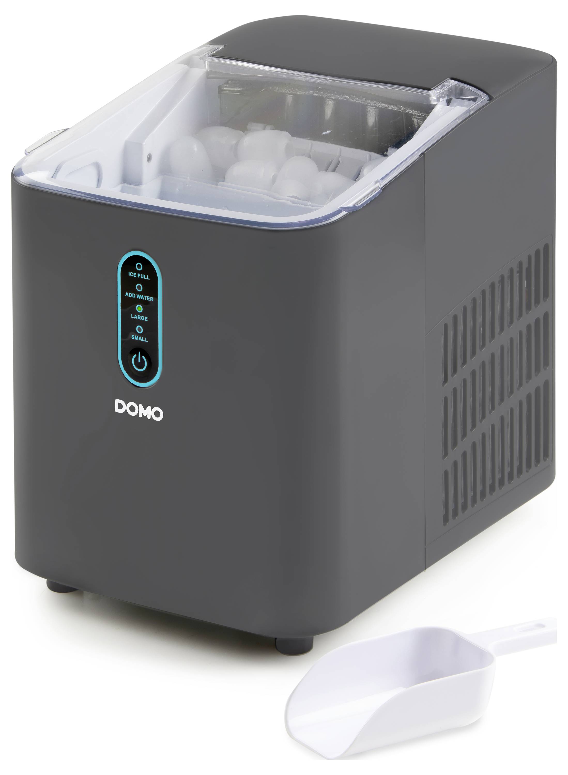 'Ice cube machine in a black casing with a transparent lid and controls on the front. White portioning scoop beside it.'