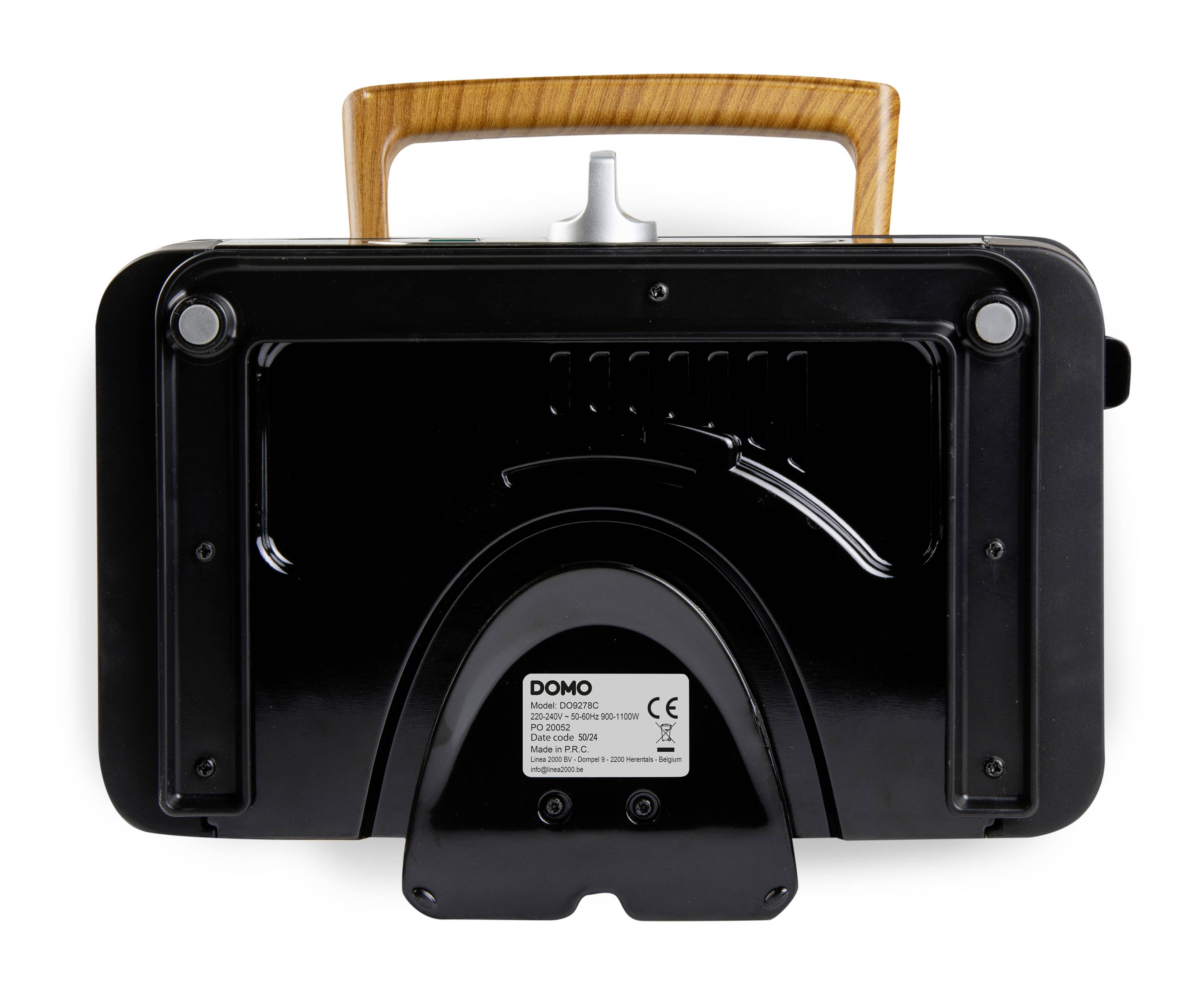 Black, rectangular device with a wooden handle on top; label in the centre with information about the brand and technical details.
