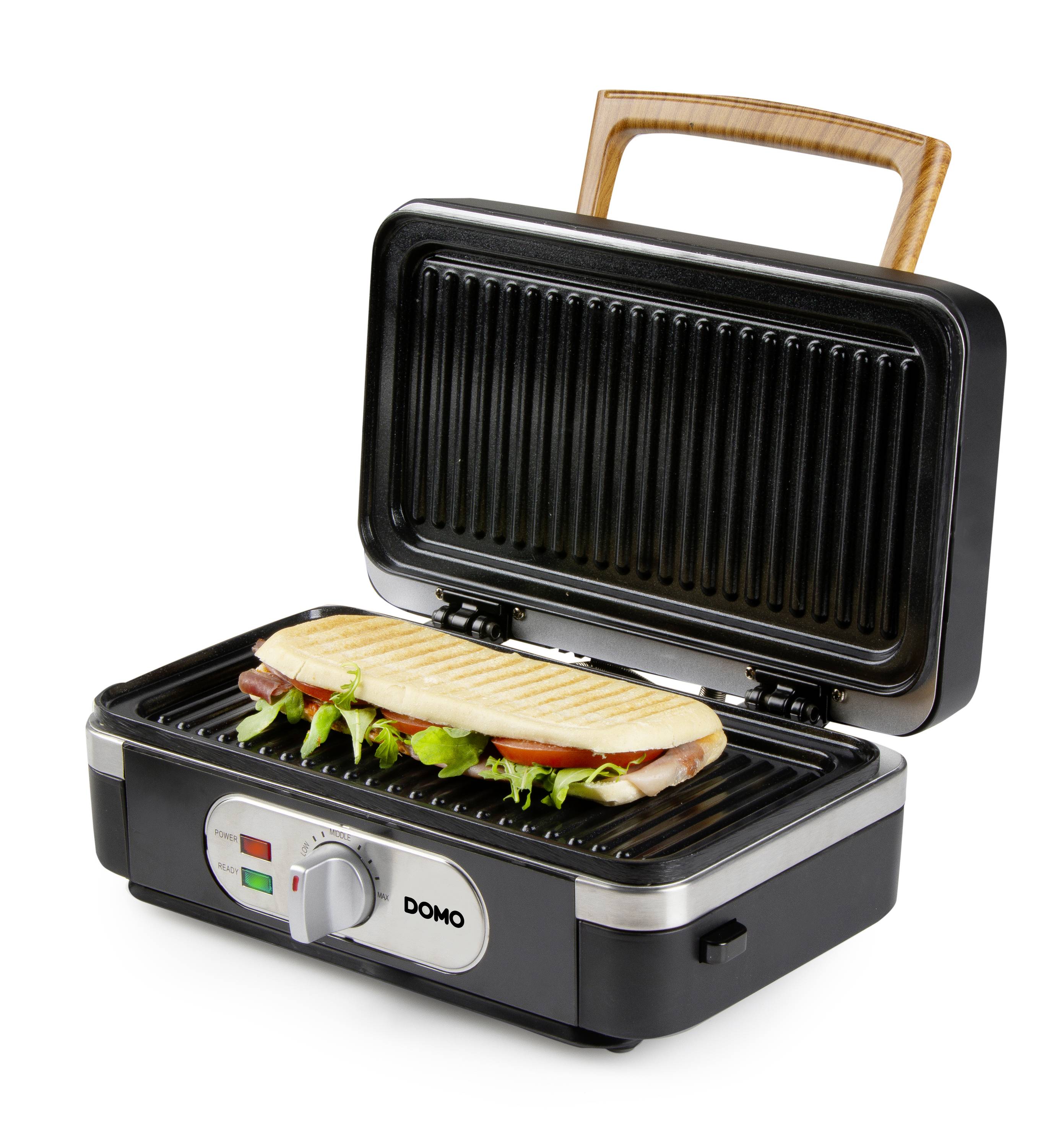 An electric grill with a Panini sandwich inside, the lid open. The grill has a wooden handle design.