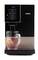 A coffee machine pours hot water into a cup with a tea bag. The display shows 200 ml.
