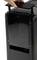 'Close-up of a hand opening the top of a modern black device, possibly an air purifier or similar appliance.'