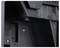 Close-up of part of a black plastic casing with screws and interlocking components, possibly an electrical device.