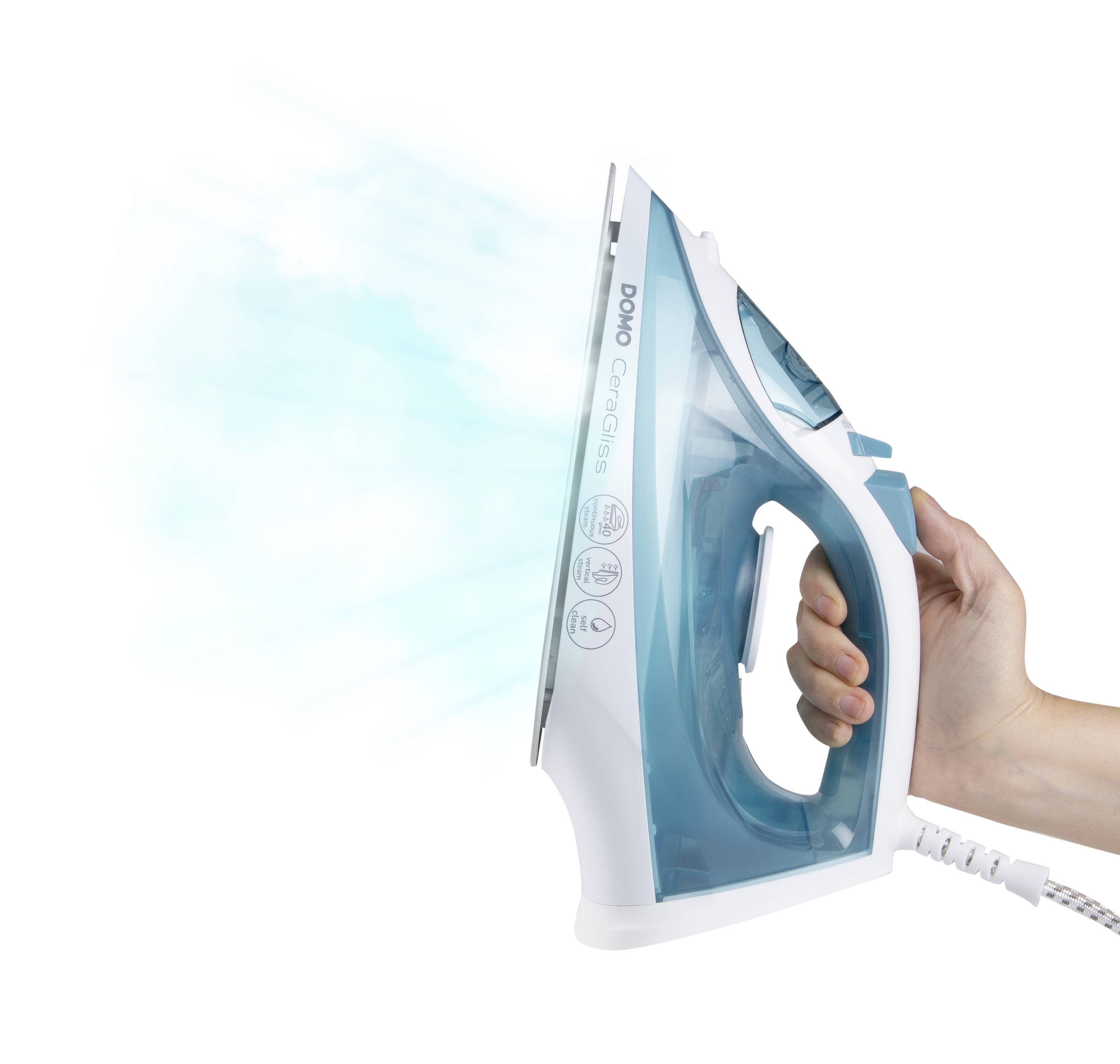 A hand is holding a white and blue steam iron, with steam emerging from it. The device is shown from the side.