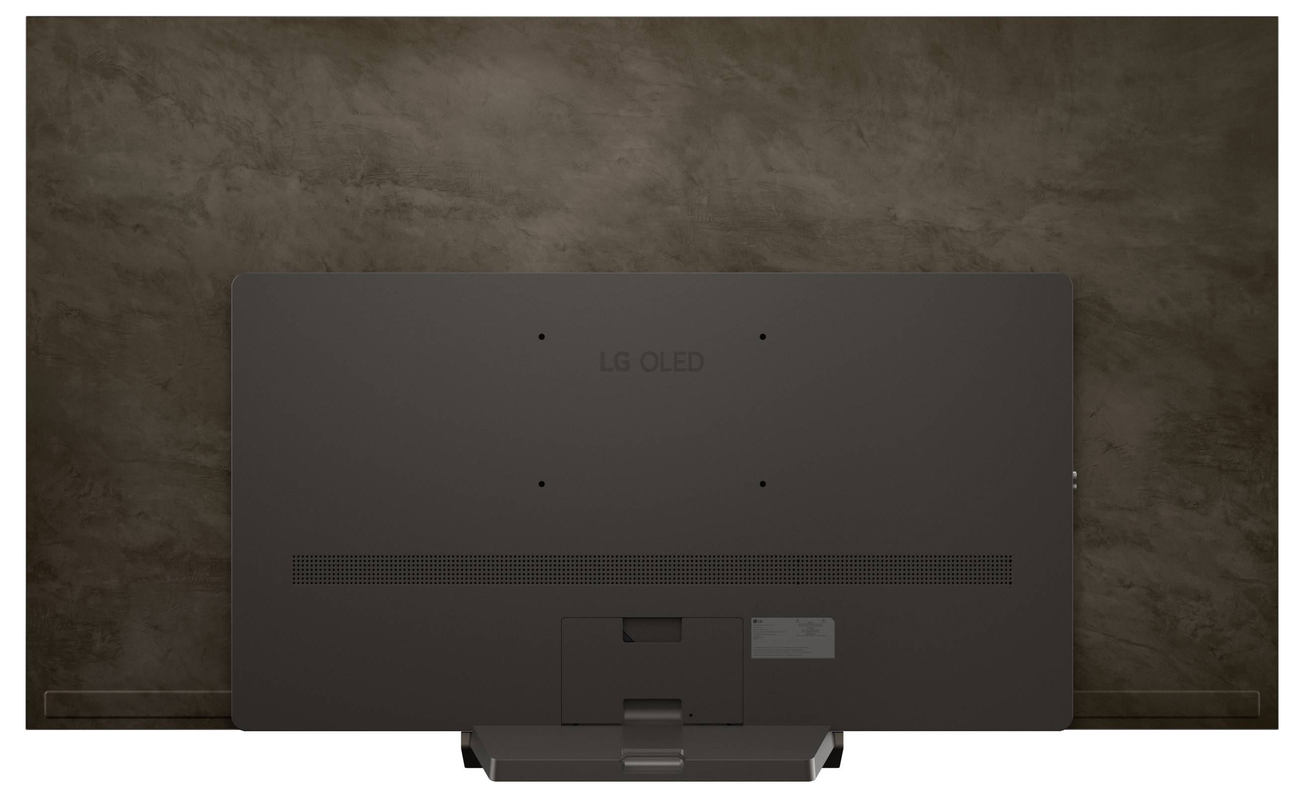 'A flat-screen TV mounted on a textured brown wall, viewed from behind, with the brand logo centered on its back panel.'