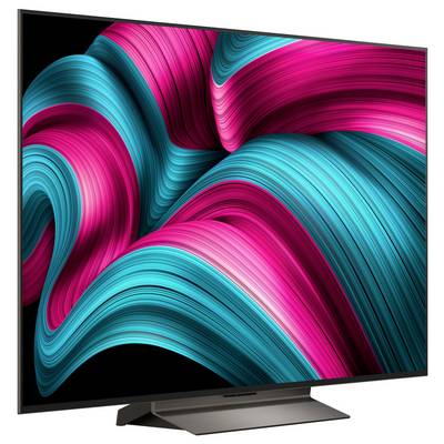 A curved LED TV displaying vibrant blue and pink abstract swirls on the screen, emphasizing vivid color and sleek design.