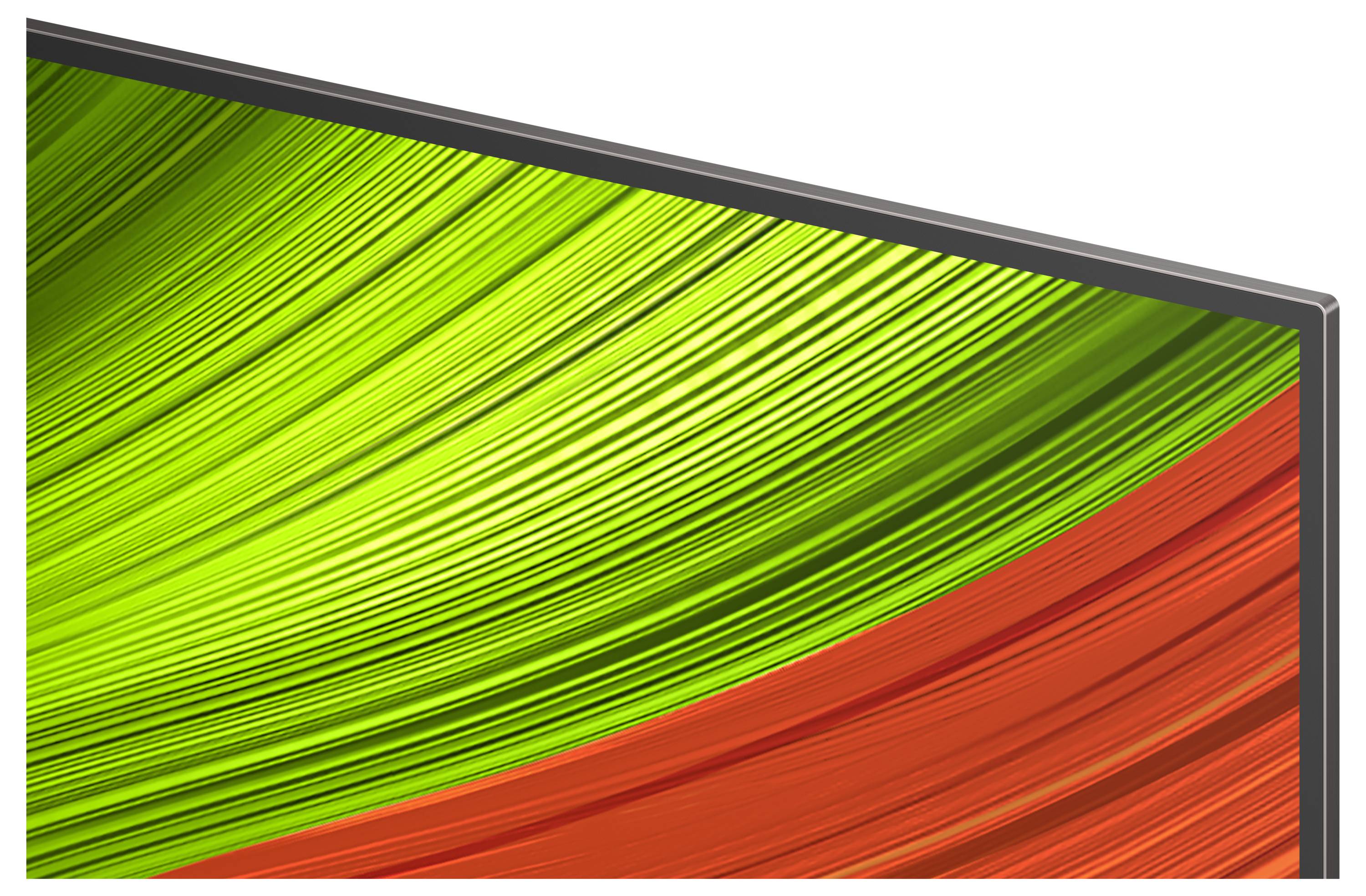 Close-up of a television screen displaying abstract green and red diagonal lines, creating a vibrant, dynamic pattern.