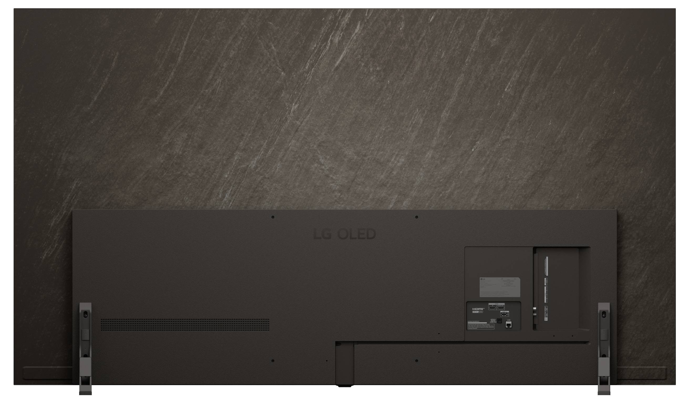 The image shows the back view of a flat-screen TV mounted on a wall. The TV has a sleek, minimalist design with visible ports.
