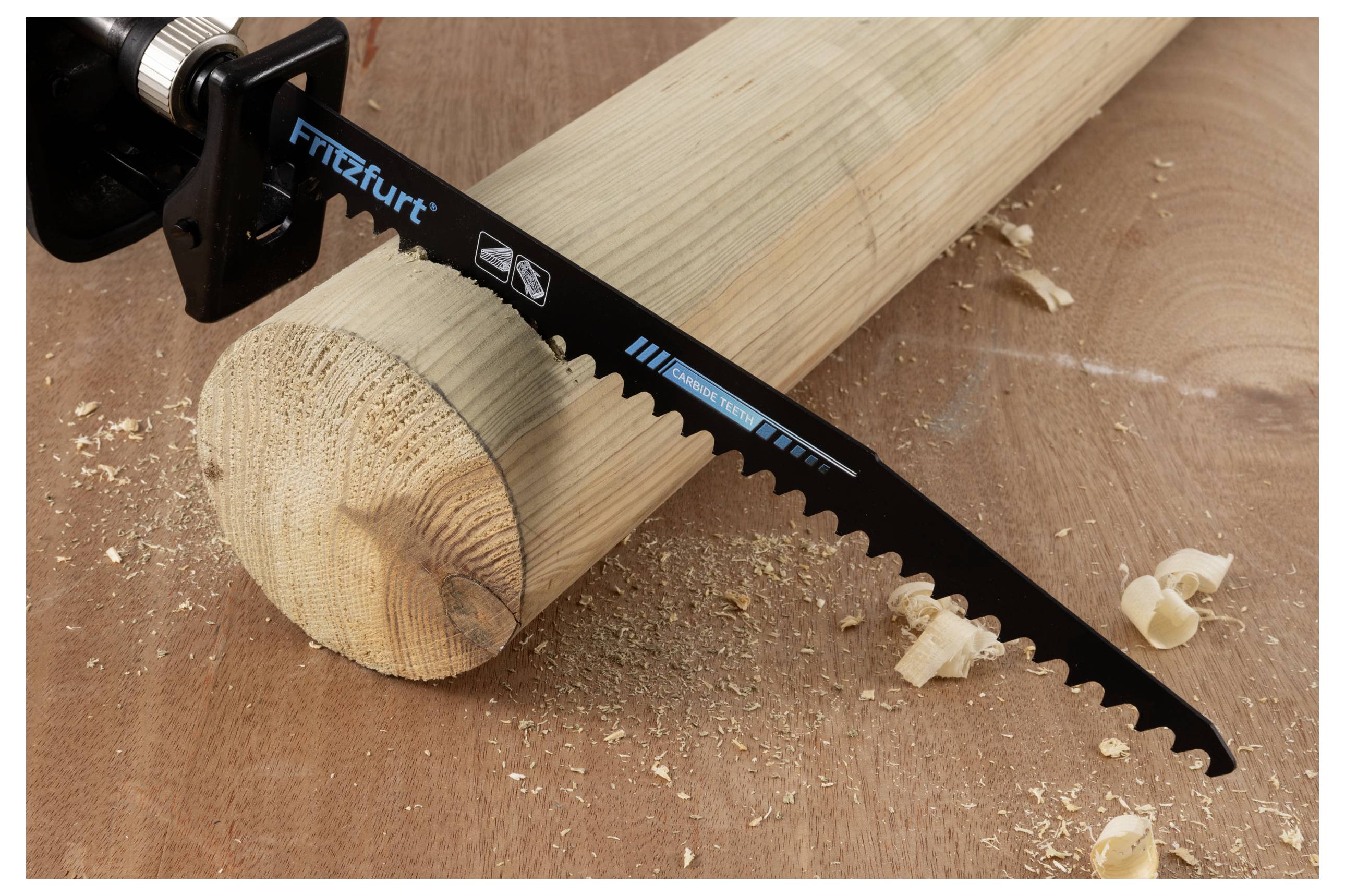 A saw blade resting on a wooden log on a workbench, with wood shavings scattered around, indicating a carpentry or woodworking task.