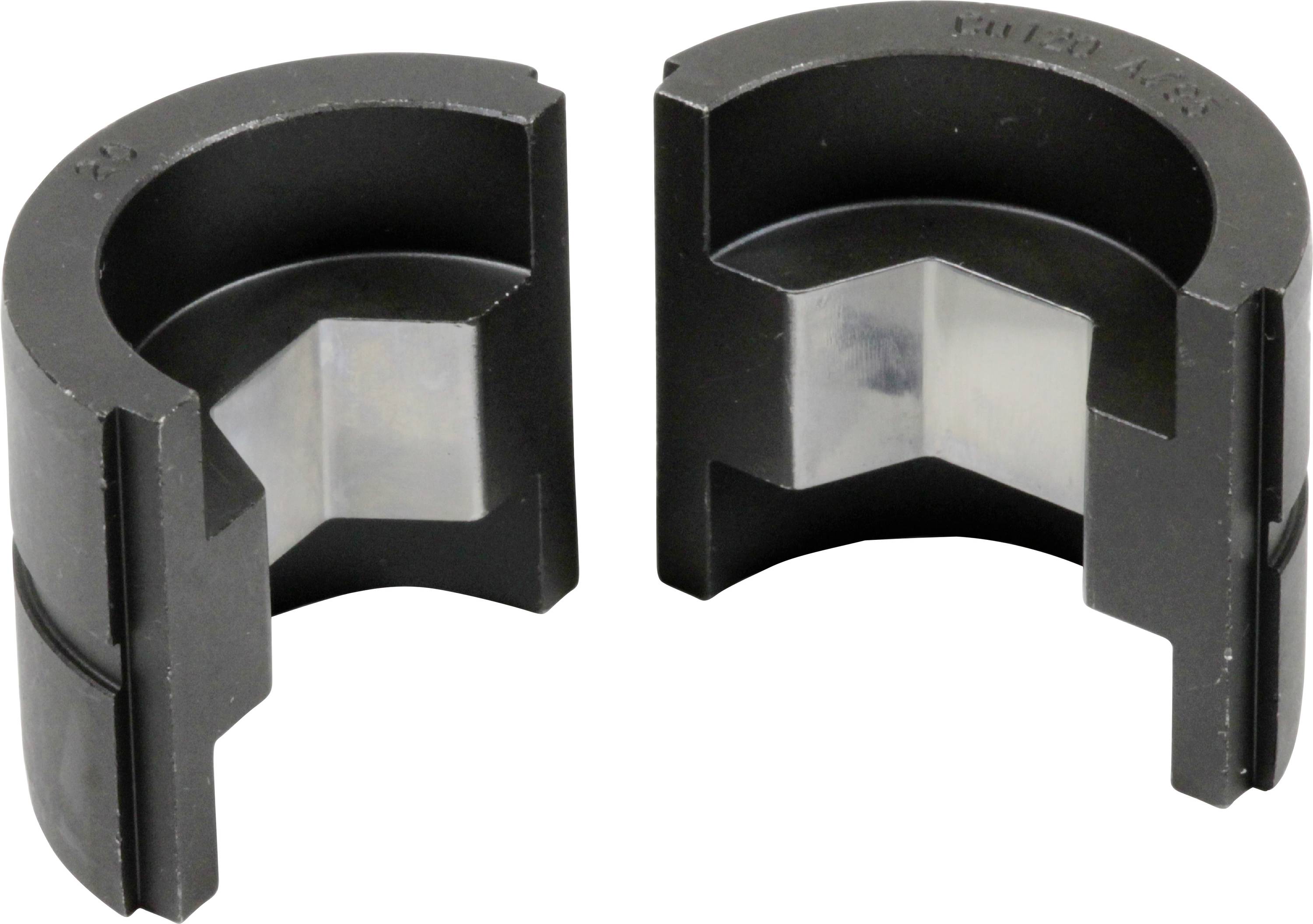 Two black, semi-circular plastic parts with internal grooves that could form a pipe clamp. Used in pipe connections.