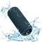 Waterproof blue speaker splashes water, demonstrating robustness and suitability for use in wet environments.