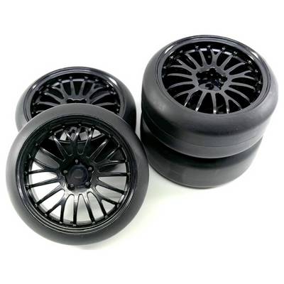 Four black car tyres with shiny rims, two standing and two lying down. Suitable for motorsport on smooth surfaces.