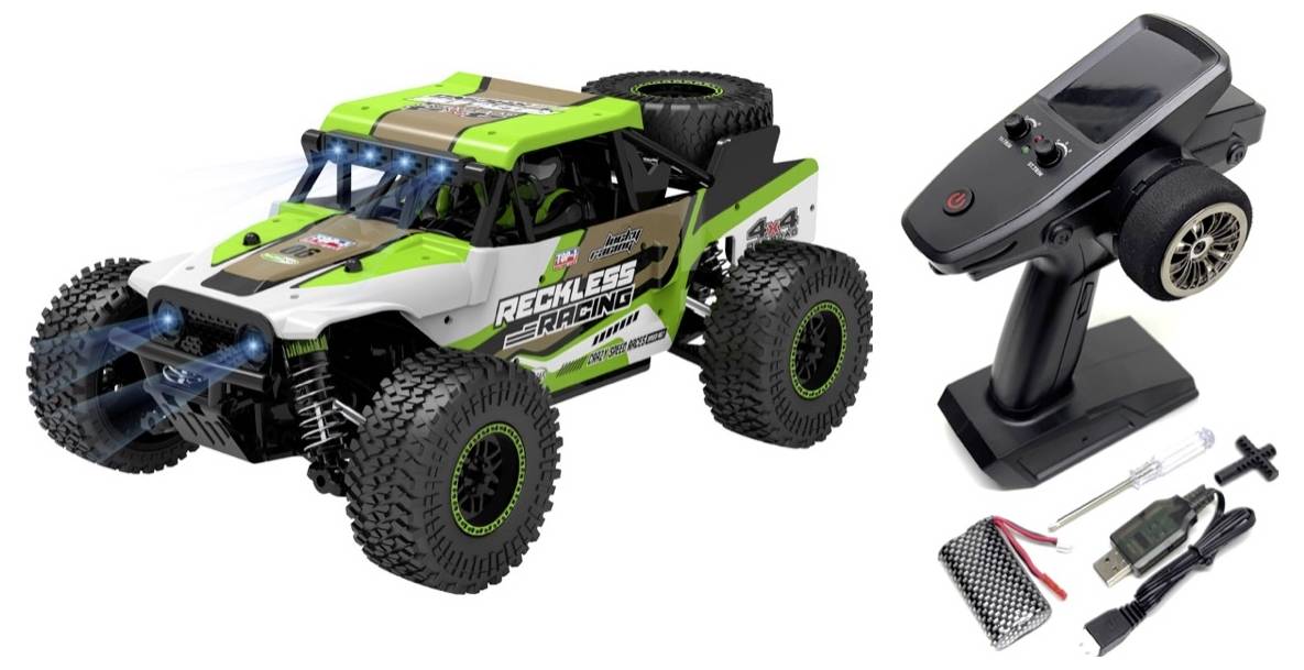 Remote-control toy truck in an off-road style with green and white paintwork. Beside the truck lies a remote control and accessories.
