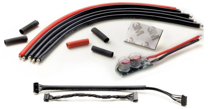Cable assembly with red and black wires, various connectors, and a circuit board with capacitors.
