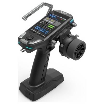 A futuristic remote control, black with a digital display, various buttons, and a large control wheel.