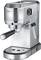 Compact silver espresso machine with a side steam wand, black handle, and drip tray. Perfect for home coffee preparation.