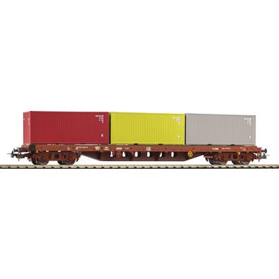 Freight train wagon with three colourful cargo containers, red, yellow and grey, on railway tracks.