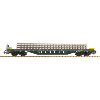 A goods wagon on a railway track is transporting stacked railway sleepers.