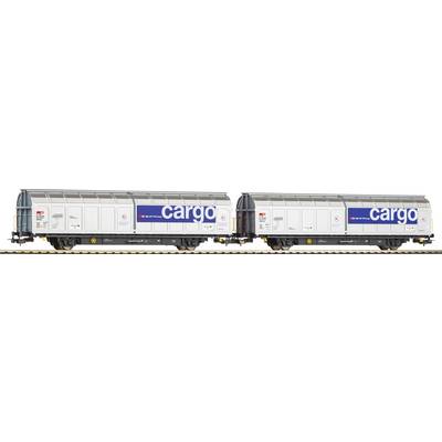 Two grey freight wagons with blue 'cargo' markings on railway tracks.