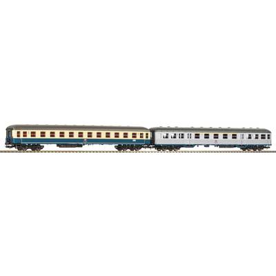 A model train with two differently coloured carriages on a track. The left carriage is beige and blue, the right one grey.
