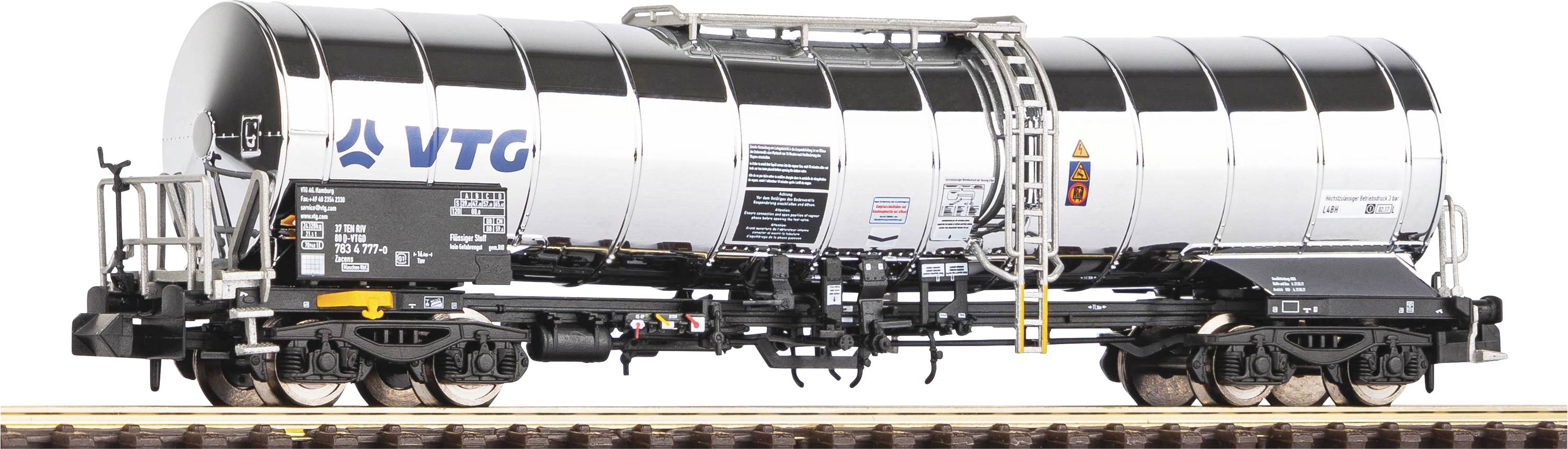 A silver tanker wagon from VTG company on a railway track. The wagon has black details and a ladder structure.