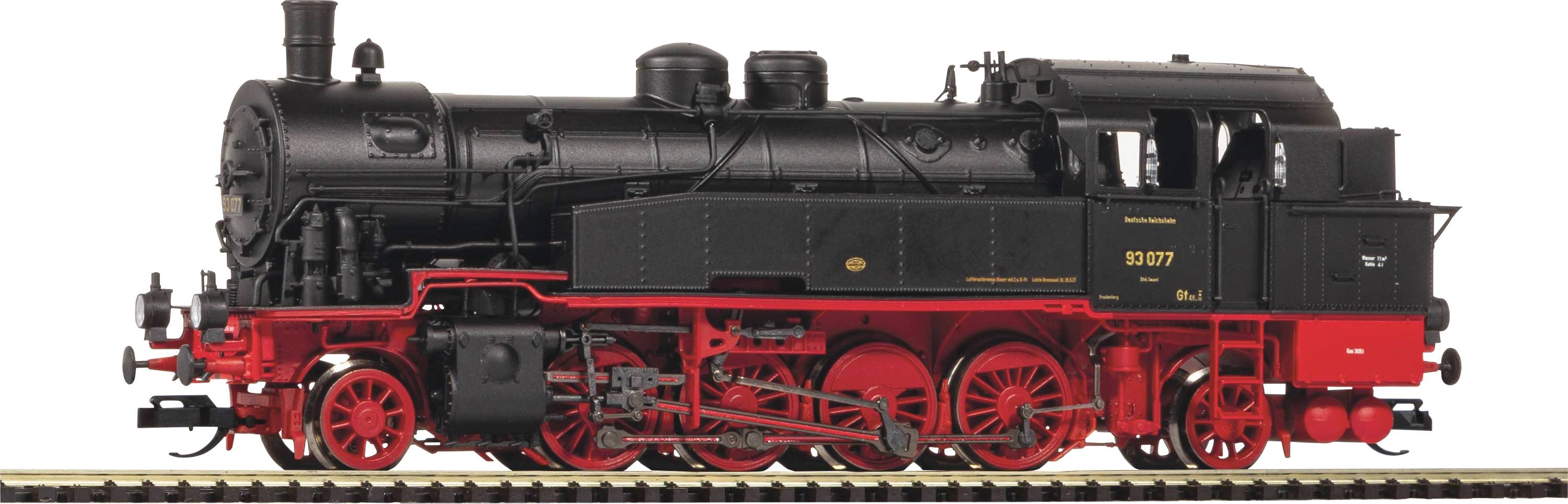 A black steam locomotive with red details and rotating wheels stands on railway tracks. It looks nostalgic and powerful.