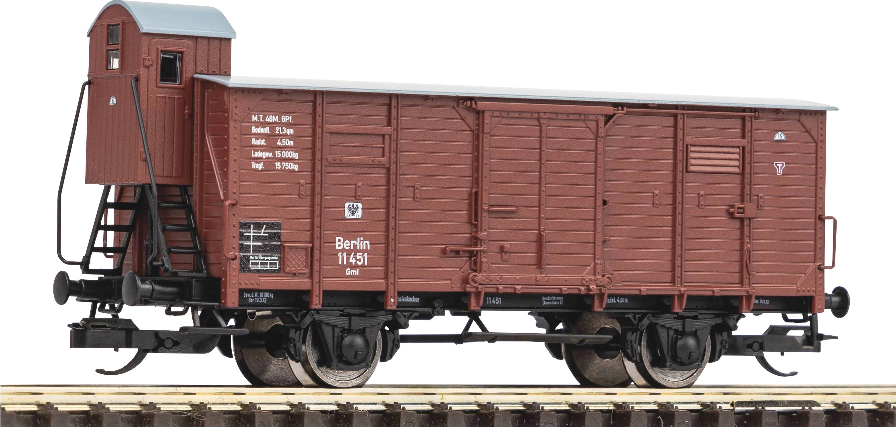 A model of a historical goods wagon in brown with the inscription 'Berlin 11451'. The wagon is positioned on a section of railway track.