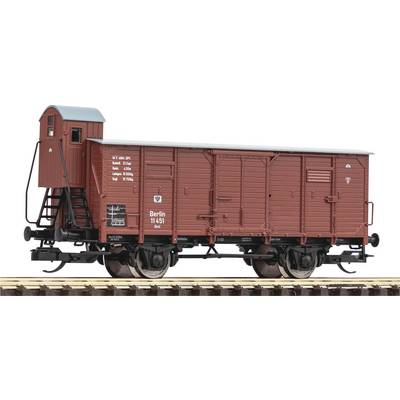 A model of a historical goods wagon in brown with the inscription 'Berlin 11451'. The wagon is positioned on a section of railway track.
