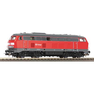 Red goods train locomotive on railway tracks, side view, with logo and class designation visible.
