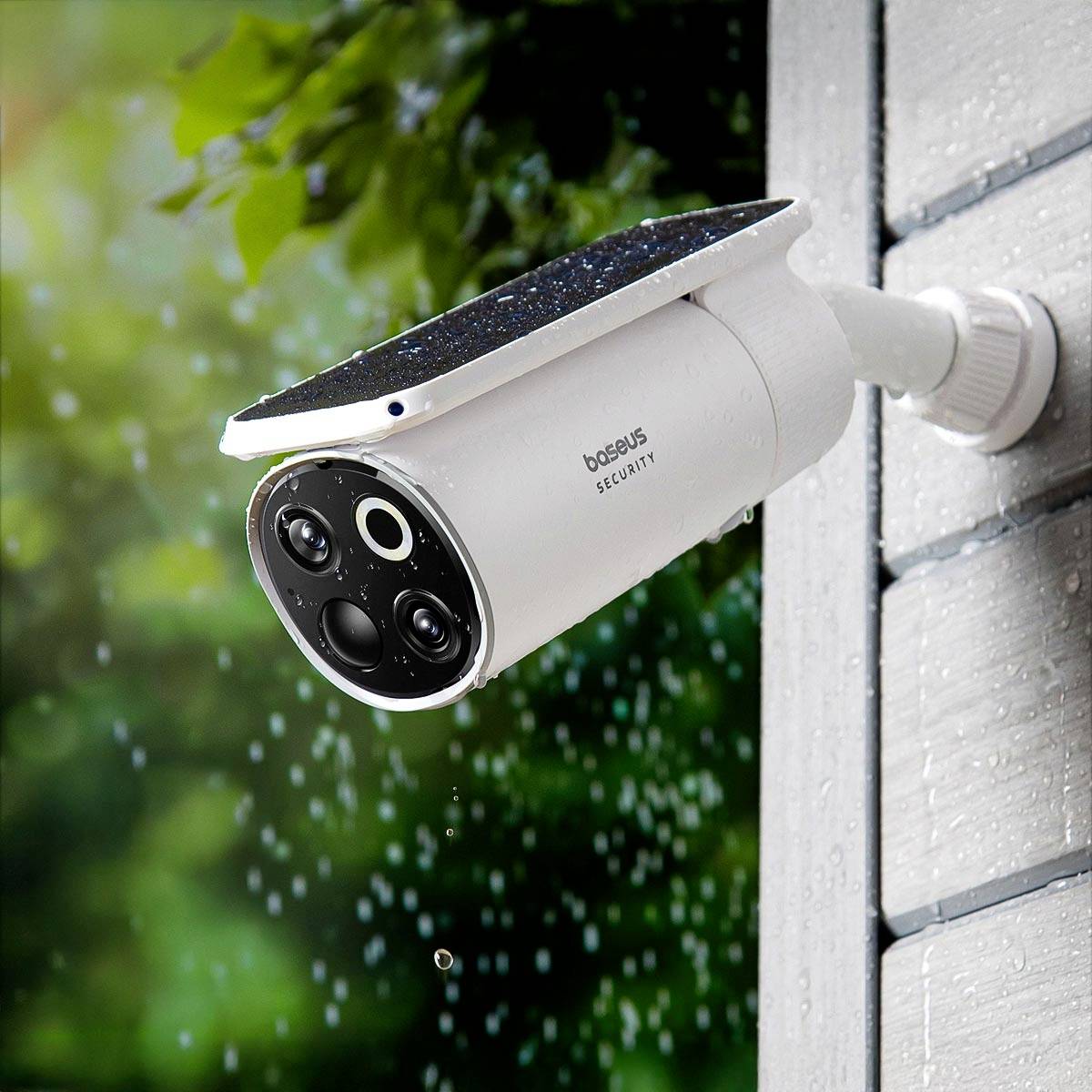 Security camera mounted on an exterior wall, installed in the rain, with a solar panel on top.