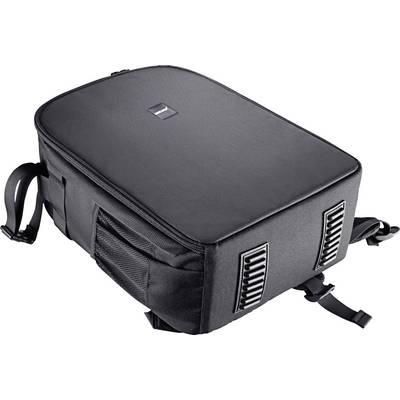 A black rucksack is lying flat on its side, with mesh pockets and adjustable straps, perfect for travelling or hiking.