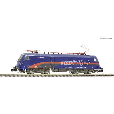 A blue 'nightjet' locomotive is standing on railway tracks. It has red and orange stripes and is designed for night trains.