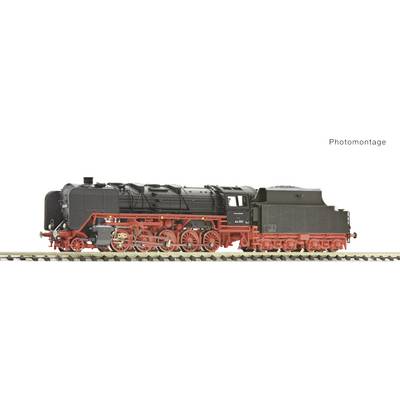 Model railway locomotive in black and red colours on a track, shown from the side. An example of historical trains.