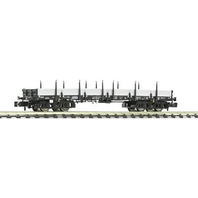 A black goods wagon with a white cover is standing on a railway track, suitable for transporting large, flat items.