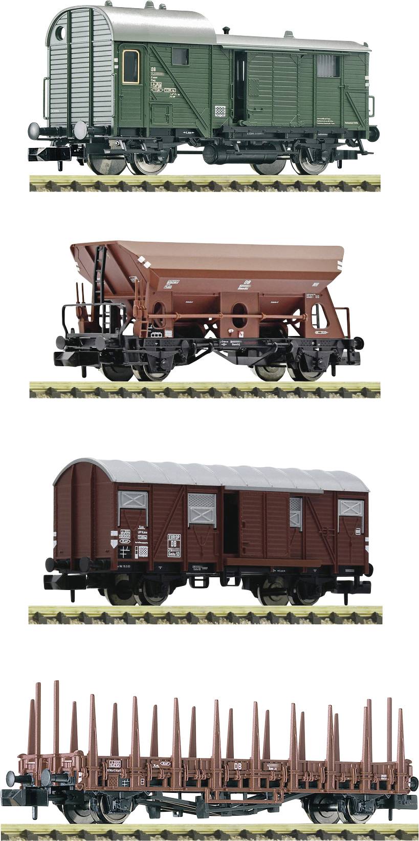 Four model railway wagons in a row: a green goods wagon, a red bulk carrier, a red covered wagon, and a red flatbed wagon.