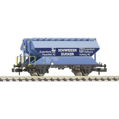 A blue freight wagon with the inscription 'Swiss Sugar' and sugar factory logos, standing on railway tracks.