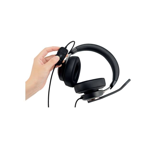 A hand is holding a black headset with a microphone; suitable for computer or online communication.