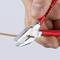 A pair of red pliers cuts a thin, orange cable. A hand grips the pliers firmly.