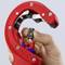 Red pipe cutter pliers held in one hand, showing sharp blade and adjustment wheel. Tool is used for precise pipe cutting.