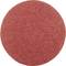 Round, red abrasive disc made of sandpaper, for surface finishing.