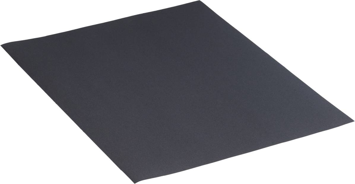 A single sheet of fine-grained sandpaper in rectangular form, black, lies flat on a surface.